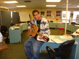 Student with a guitar.
